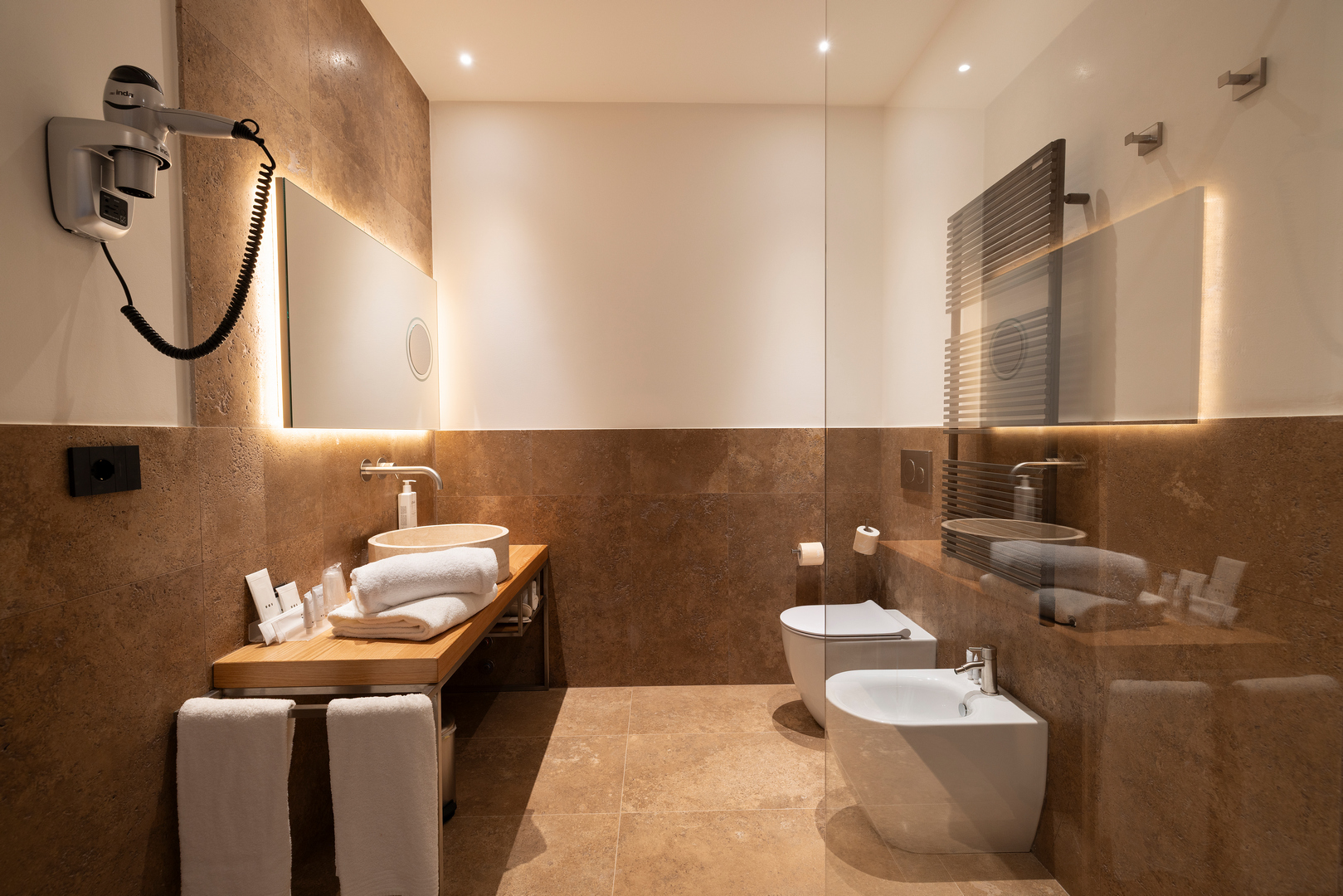 The bathrooms of the first-floor rooms in the new Casale Le Poggiole, adjacent to Villa Grazianella