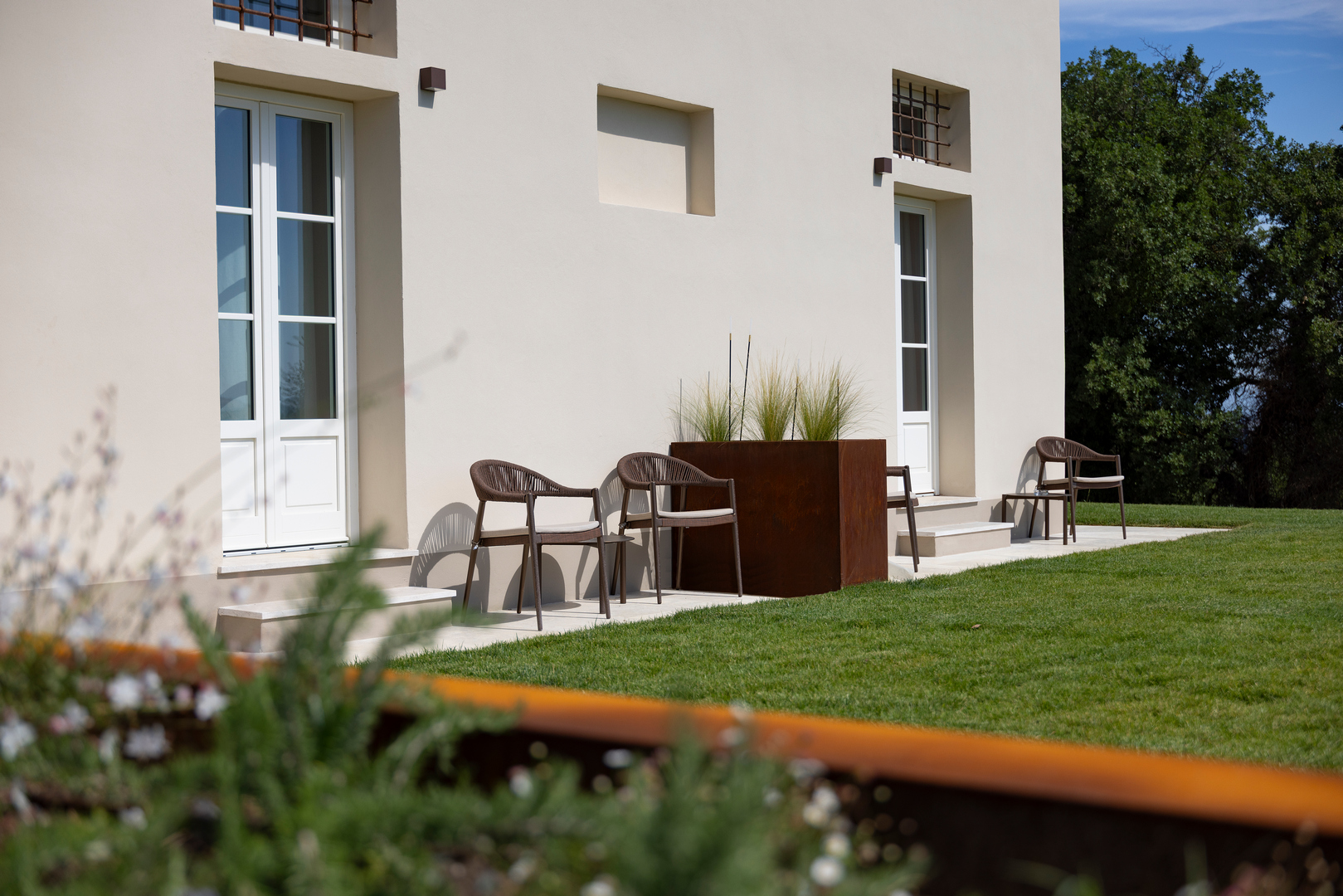 The outdoor areas of the ground-floor rooms at the new Casale Le Poggiole, adjoining Villa Grazianella